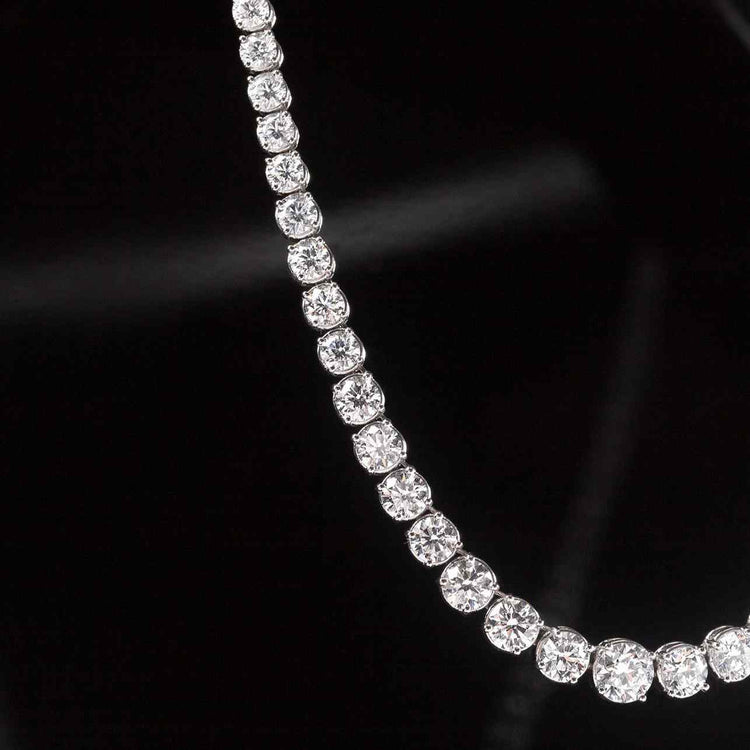 The Collier Rivière Necklace features graduated diamonds - a crescendo towards the main (and largest) diamond that sits at the center of this necklace.
