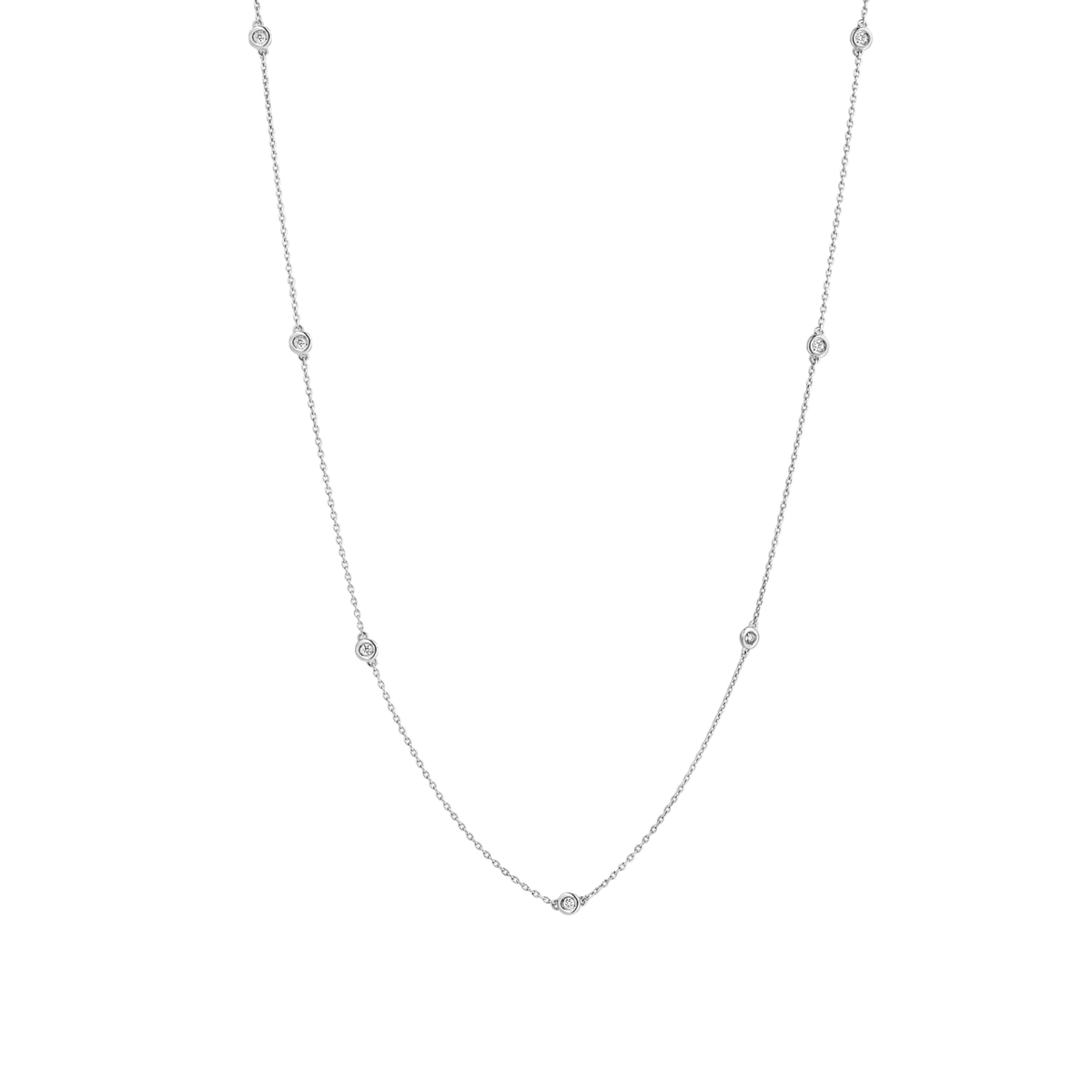 7 bezel-set round brilliants wrap around a 16" (40 cm) chain of recycled 18k White Gold totaling 3.8 grams. Reach out to our Atelier to customize.