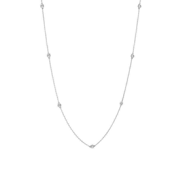 7 bezel-set round brilliants wrap around a 16" (40 cm) chain of recycled 18k White Gold totaling 3.8 grams. Reach out to our Atelier to customize.