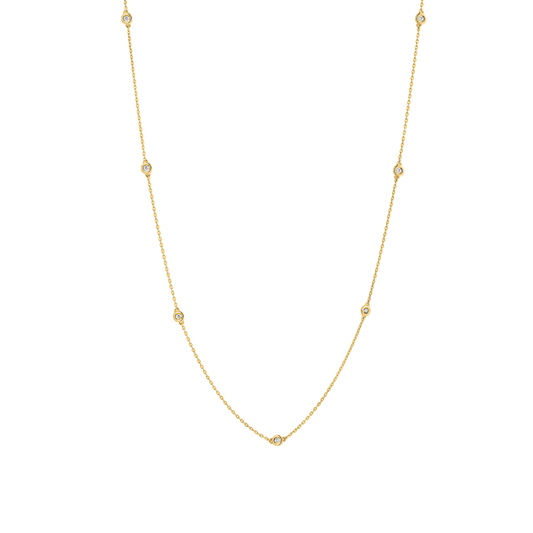 7 bezel-set round brilliants wrap around a 16" (40 cm) chain of recycled 18k Yellow Gold totaling 3.8 grams. Reach out to our Atelier to customize.