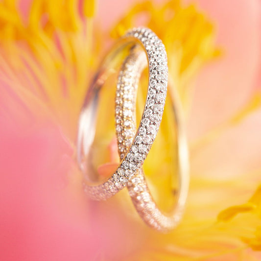 The Dalliance Pavé Rings - both White Gold and Yellow Gold shown on their sides here - feature three rows of pavé diamonds to allow maximum sparkle on the finger.