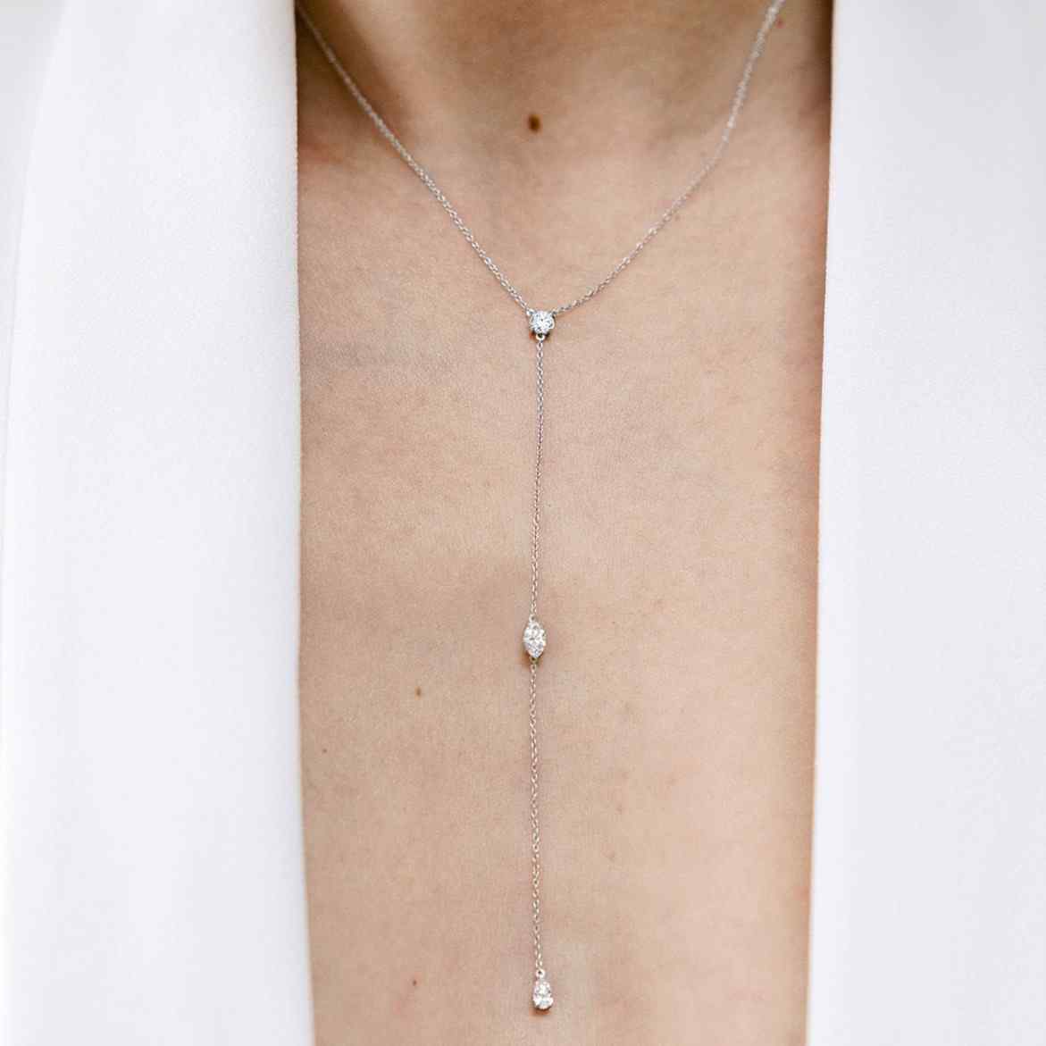 Three 0.25ct diamonds are strung along a 18k gold chain. Diamond shapes from top to bottom are: Round, Marquise, Pear. The collar of the necklace measures 16 inches (40cm); the length of the drop is 4 inches (10cm). To customize, please write to our Atelier. 18k White Gold shown here.
