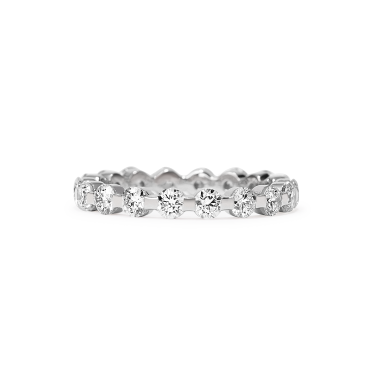 The Sans Cesse Solene Eternity features the highest quality diamonds - D color, IF/VVS clarity - in a classic scalloped setting, which makes it perfect for pairing with other rings from the Sans Cesse Collection.