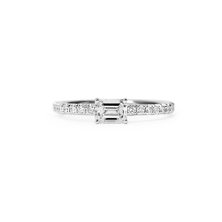 The Trois Pierres Emerald ring features recycled 18k gold and 1.3 carat Emerald of D color, IF/VVS clarity.