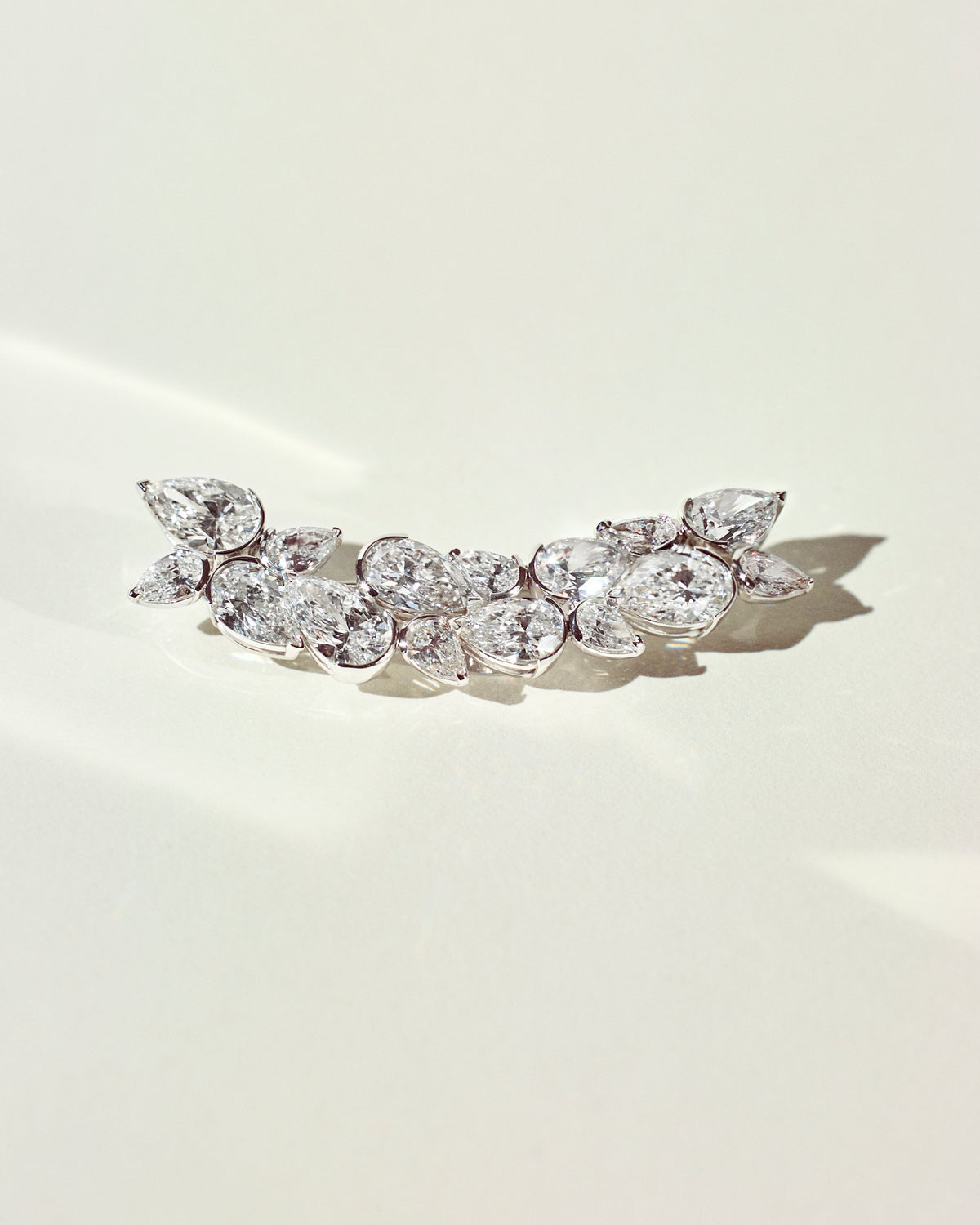 Custom Process: Delivery - Following the diamond setting, our in-house team performs a final check to ensure the piece is crafted with exquisite precision to maximize brilliance.  All pieces are shipped with complimentary worldwide shipping & shipping insurance. All duties & taxes are handled by Or & Elle. Pictured here, the final product, is the Branche d'Arbre lapel pin, which was custom made for Pete Davidson for the 2022 Met Gala.