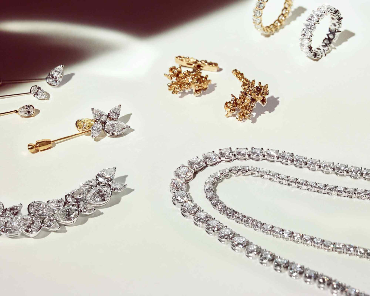 Our Atelier at Or & Elle specializes in creating one-of-a-kind custom jewelry pieces. Shown here are Lapel Pins from our forthcoming Falling Leaves collection, the Les Arbres Cufflinks, and two Colliers from our high jewelry collection. All made with D color, IF/VVS clarity diamonds and recycled 18K gold and palladium.