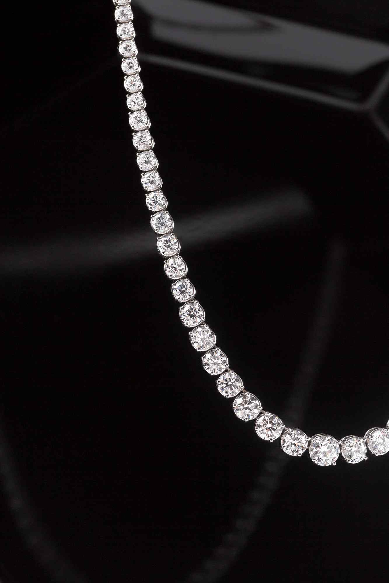 The Collier Rivière Necklace features graduated diamonds - a crescendo towards the main (and largest) diamond that sits at the center of this necklace. 