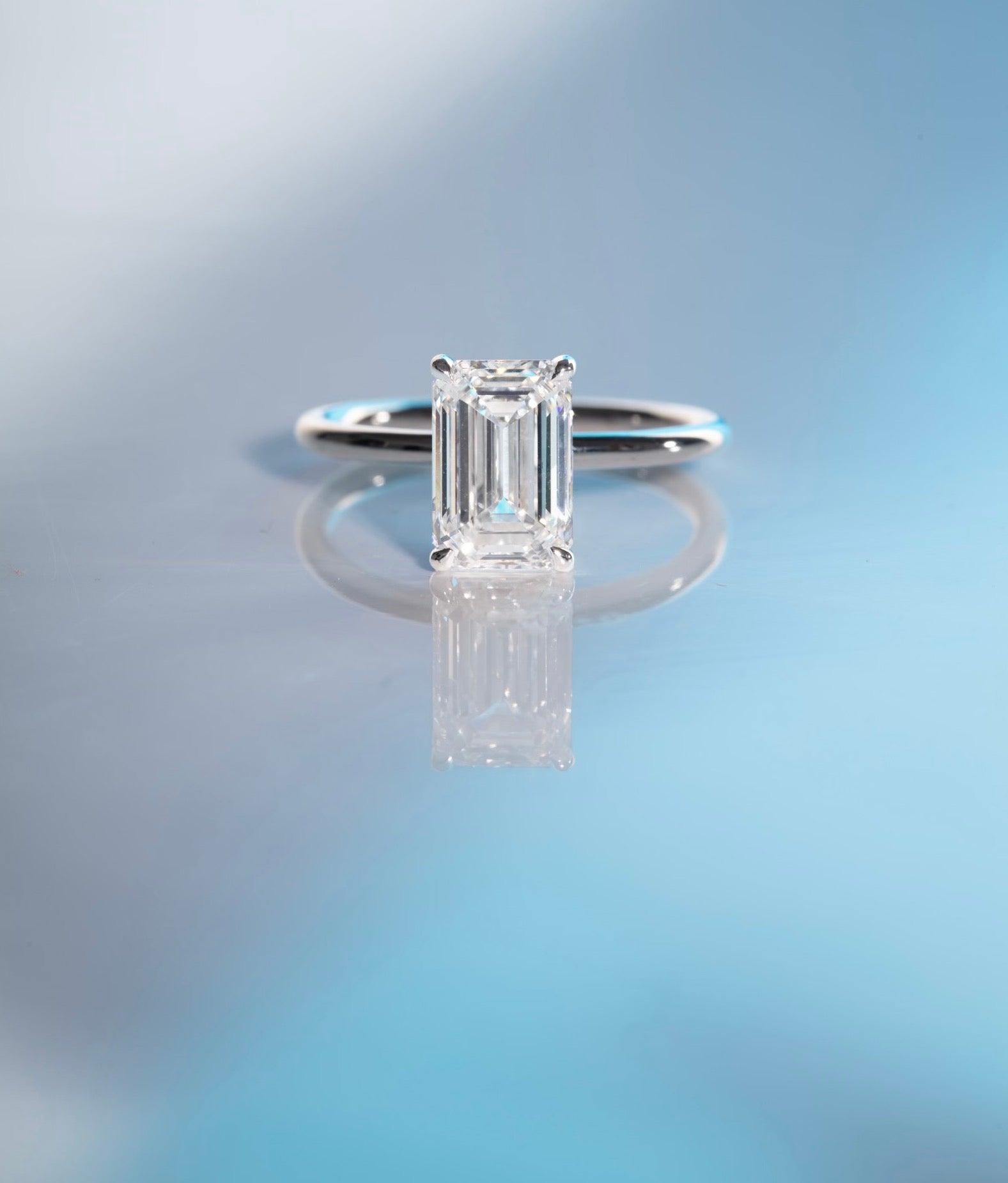 Or & Elle Engagement Suite. A custom 2.8 carat emerald diamond engagement ring with a thin 18K White Gold and Palladium band. OR & ELLE SPECIALIZES IN CUSTOM ENGAGEMENT JEWELRY TO CELEBRATE LIFE'S MOST INTIMATE MOMENTS. EACH ONE-OF-A-KIND DIAMOND IS SOURCED SPECIFICALLY FOR OUR CLIENTS.