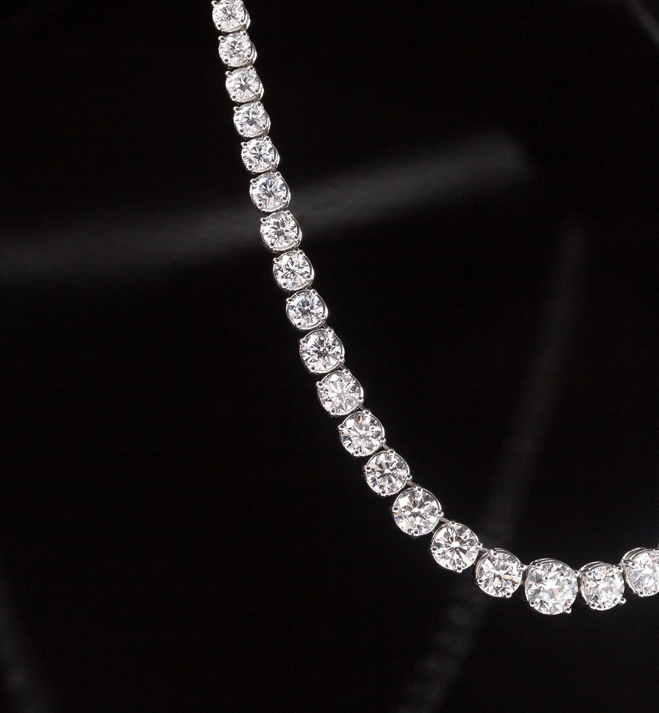 The Collier Rivière Necklace features graduated diamonds - a crescendo towards the main (and largest) diamond that sits at the center of this necklace.