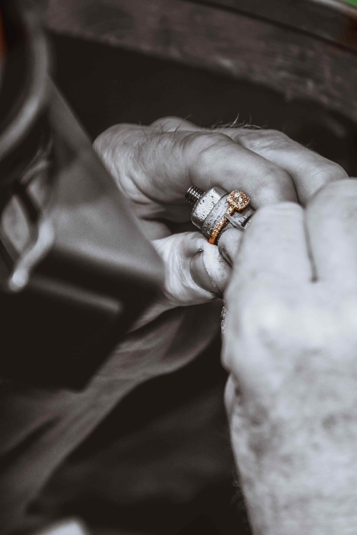 Behind the Scenes in our Atelier - an artisan is handcrafting a diamond ring.