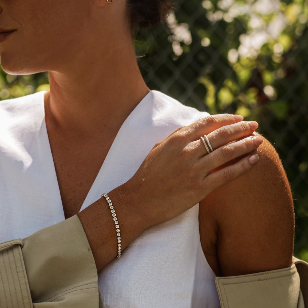 In collaboration with Meaghan Cox, Jenni Kayne's Chief Brand Officer, we married the timelessness and memories of her Mother’s heirloom jewelry with the sustainable ethos shared deeply by Meaghan and our Atelier. Meaghan, pictured here, is wearing the Bracelet George Rivière with the Collier de Diamants tennis necklace and Sans Cesse Oval Eternity ring. All in 18K White Gold for maximum sparkle.