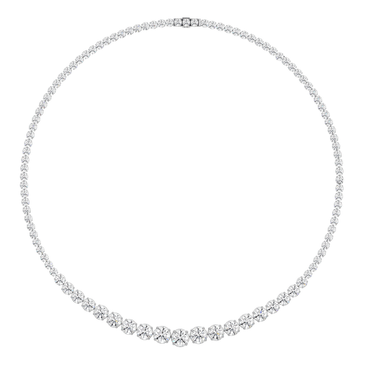 This 25ct graduated diamond tennis necklace features flawless round brilliants in a four prong solitaire setting. Paired here with the Collier de Diamants - our uniform tennis necklace, for the ultimate stack. D-color, IF/VVS diamonds crescendo toward a center diamond of 1ct. The length of this striking piece is 16 inches (40cm).