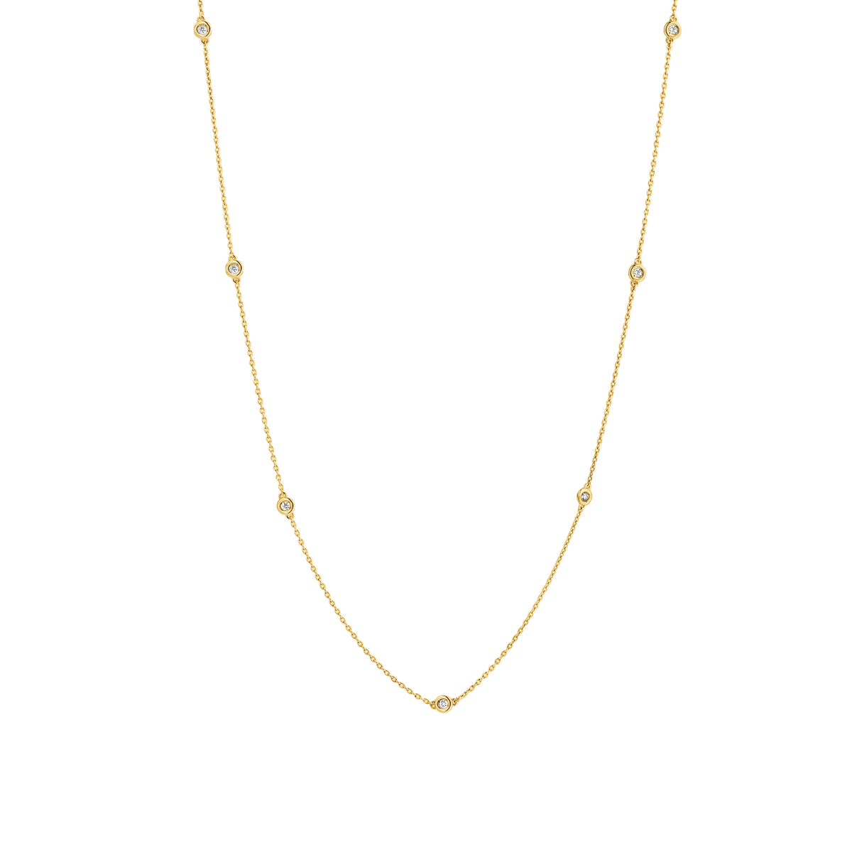 7 bezel-set round brilliants wrap around a 16" (40 cm) chain of recycled 18k Yellow Gold totaling 3.8 grams. Reach out to our Atelier to customize.