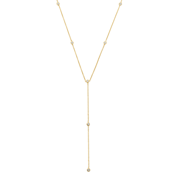 9 bezel-set round brilliants wrap around a drop chain lariat of recycled 18K gold. The collar of the necklace measures 16 inches (40cm); the length of the drop is 4 inches (10cm). To customize, please write to our Atelier.