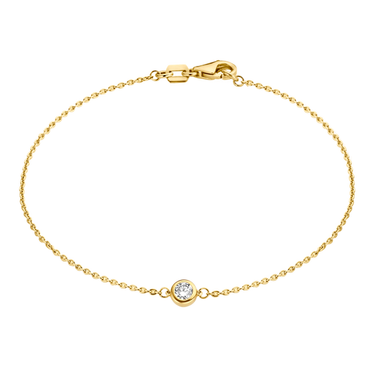 A solitaire 0.1 carat round brilliant is bezel set in 18k recycled gold. This bracelet can be adjusted to two different lengths, 6.3" (16 cm) and 6.7" (17 cm). Reach out to our team for further customization options. 