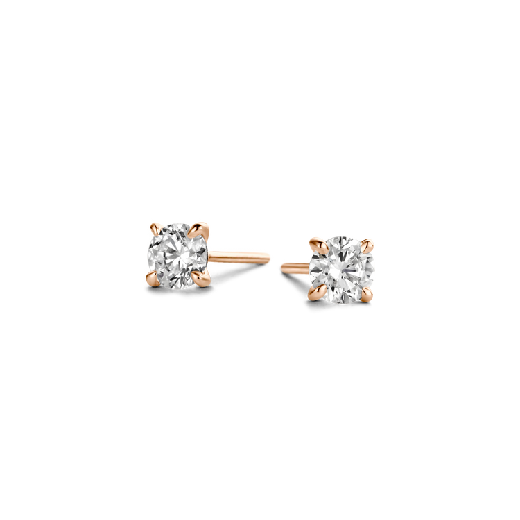 Polished 18k gold is illuminated by a solitaire D color, IF/VVS diamond, the unparalleled quality of which is on full display in a 4-prong setting. Sold as a pair; diamond carat weight refers to the total in the pair of studs. Rose Gold shown here.