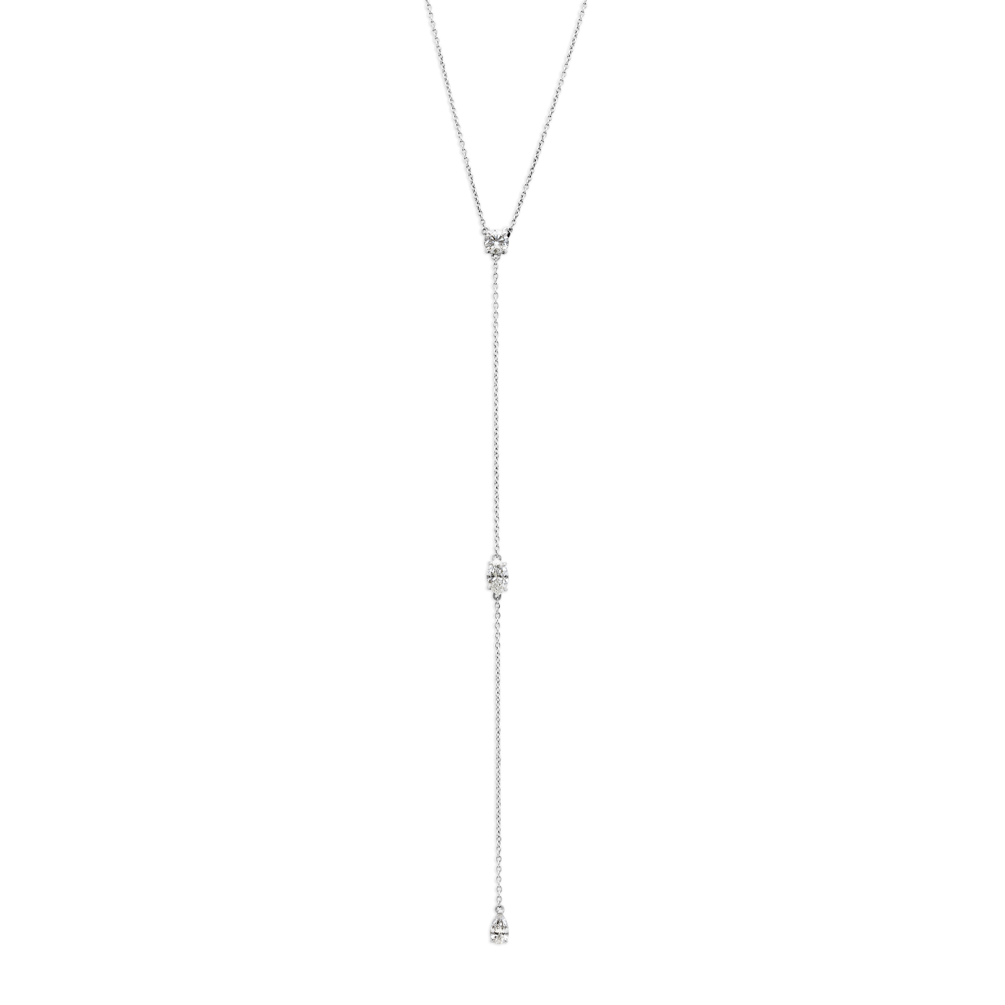 Three 0.25ct diamonds are strung along a 18k gold chain. Diamond shapes from top to bottom are: Round, Marquise, Pear. The collar of the necklace measures 16 inches (40cm); the length of the drop is 4 inches (10cm). To customize, please write to our Atelier. 18k White Gold shown here. Pair with the matching earrings in the Lariat collection.
