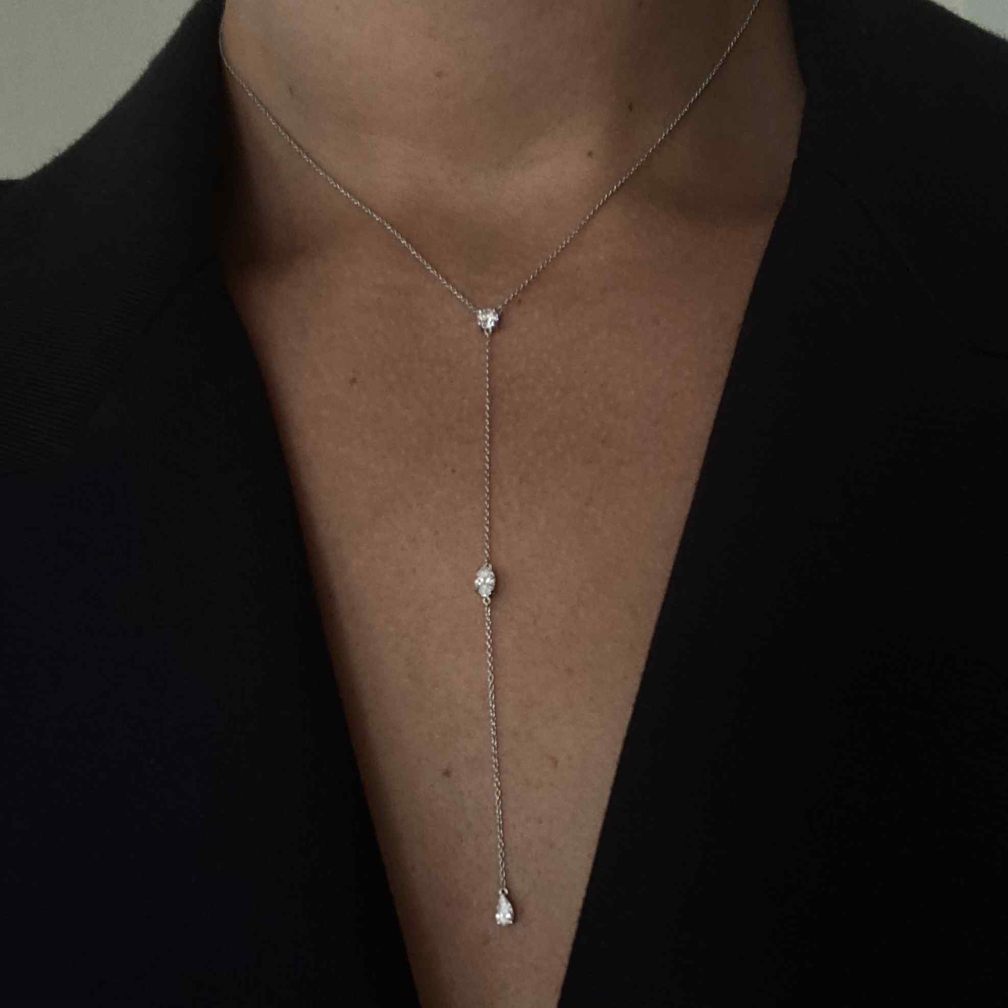 Three 0.25ct diamonds are strung along a 18k gold chain. Diamond shapes from top to bottom are: Round, Marquise, Pear. The collar of the necklace measures 16 inches (40cm); the length of the drop is 4 inches (10cm). To customize, please write to our Atelier. 18k White Gold shown here.