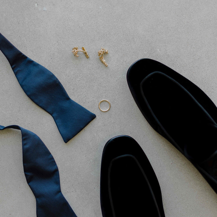 Les Arbres Cufflinks shown with other Men's Wedding Day essentials - velvet shoes and bowtie, with a custom Or & Elle Gold Men's Wedding Band.