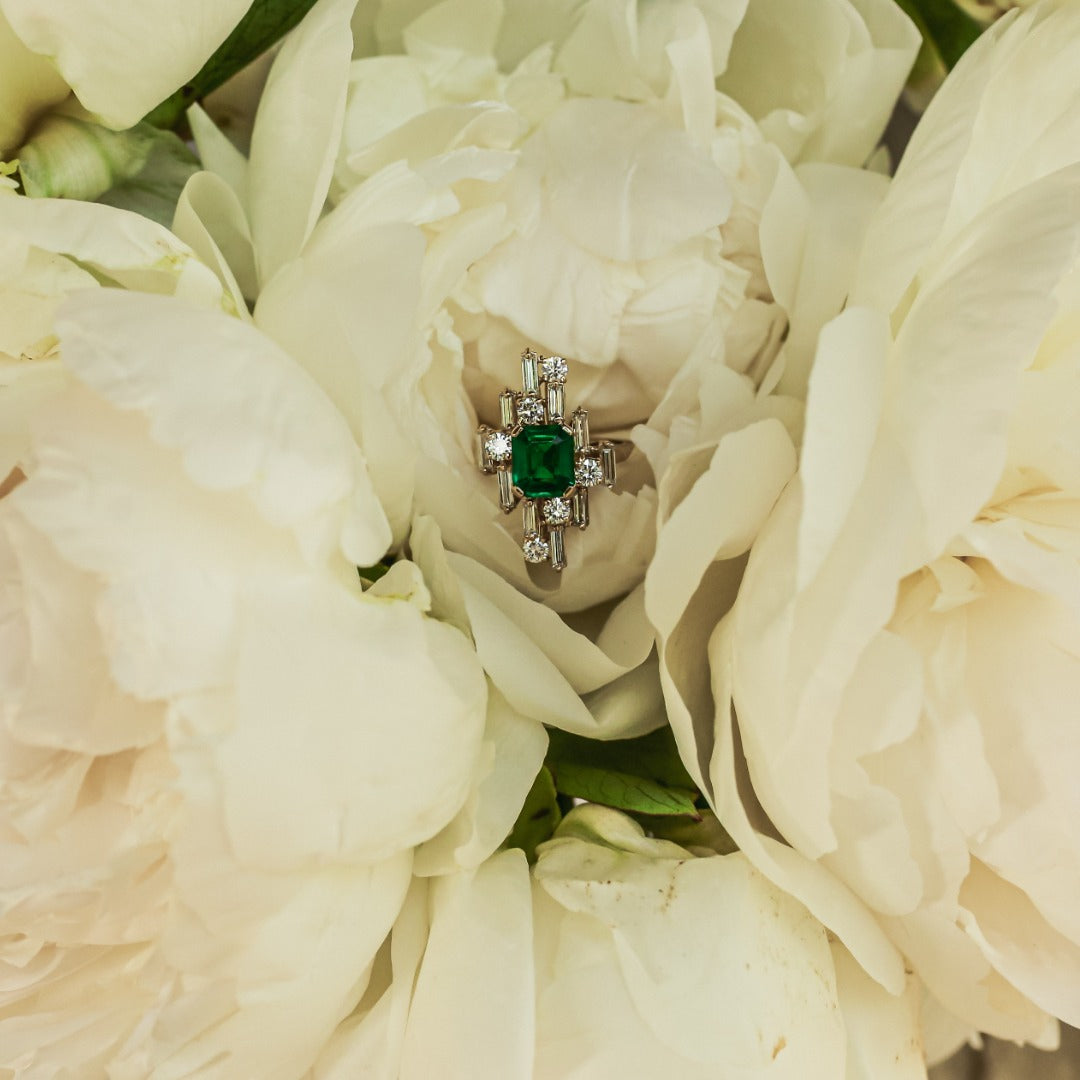 Inspired by the Art Deco period, this inimitable cocktail ring - the Nina - bespeaks the multilayered, dynamic, and playful era. Baguette and round diamonds are set in multidimensional space around an heirloom 2 carat Emerald. Connect with our Atelier's design experts to make yours to order and to customize the size, color, and gem of the center stone.