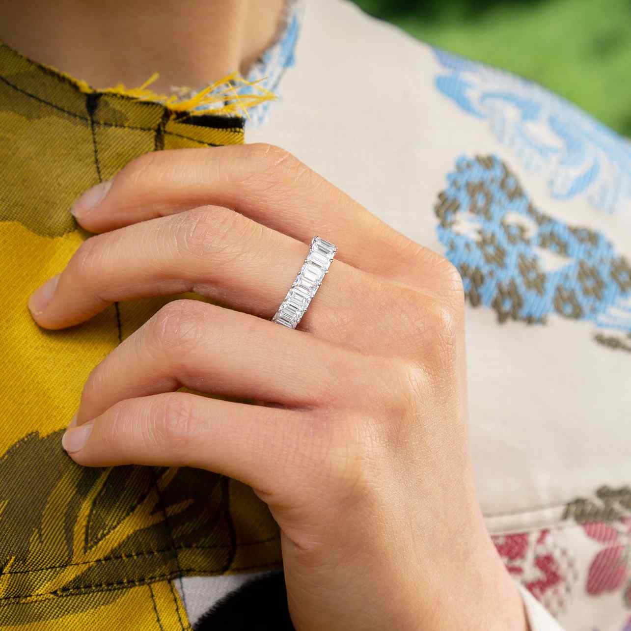 The Sans Cesse Emerald Eternity Ring - shown here in 18K White Gold and Palladium - is made of lab-grown D color, IF/VVS clarity diamonds and recycled 18K gold.