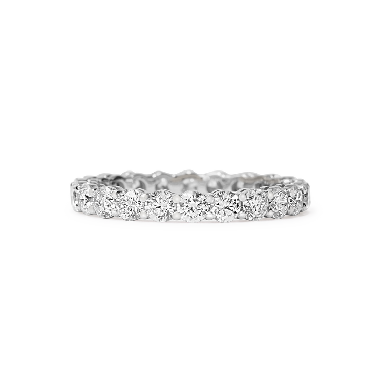 Or & Elle's Sans Cesse Round diamond eternity band features D color, IF/VVS clarity round brilliants held in recycled 18k gold by an elegant scalloped setting. Size and color are fully customizable. White gold shown here. Available in two carat weights: 2.5 and 5 (based on a U.S. size 7).