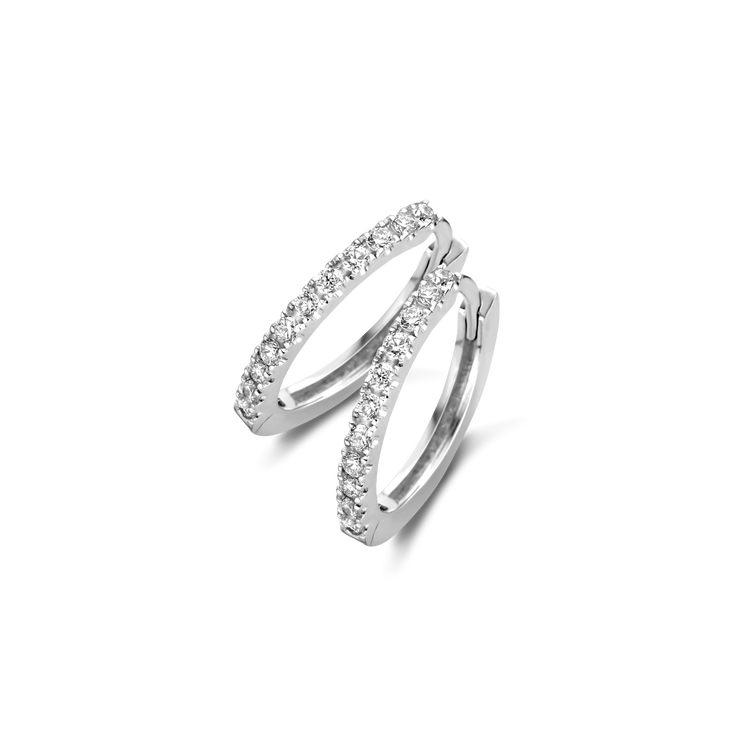 A classic 12mm diamond hoop featuring 22 D color, IF/VVS clarity round brilliants in 18k gold. Sold as a pair. Shown here in White Gold.